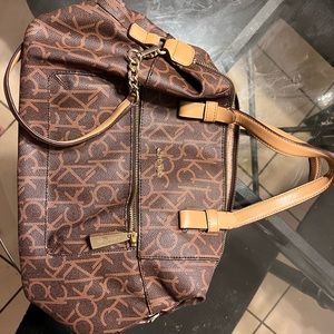 Calvin Klein hand or shoulder purse. Dark brown/light brown straps. Ck design